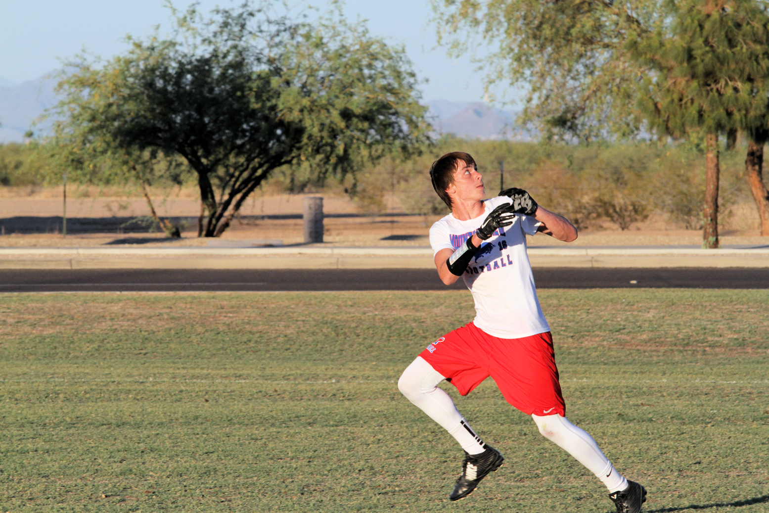 Football player prepares to catch a football